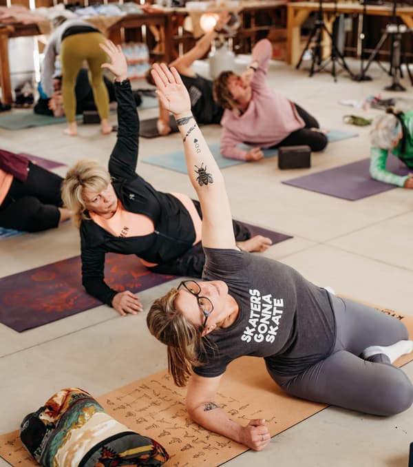 Corporate wellness class stretching together