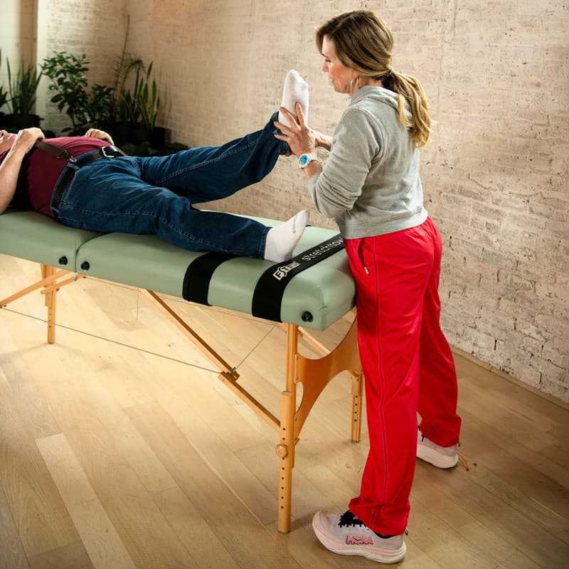 Fascial Stretch Therapy practitioner assisting a client