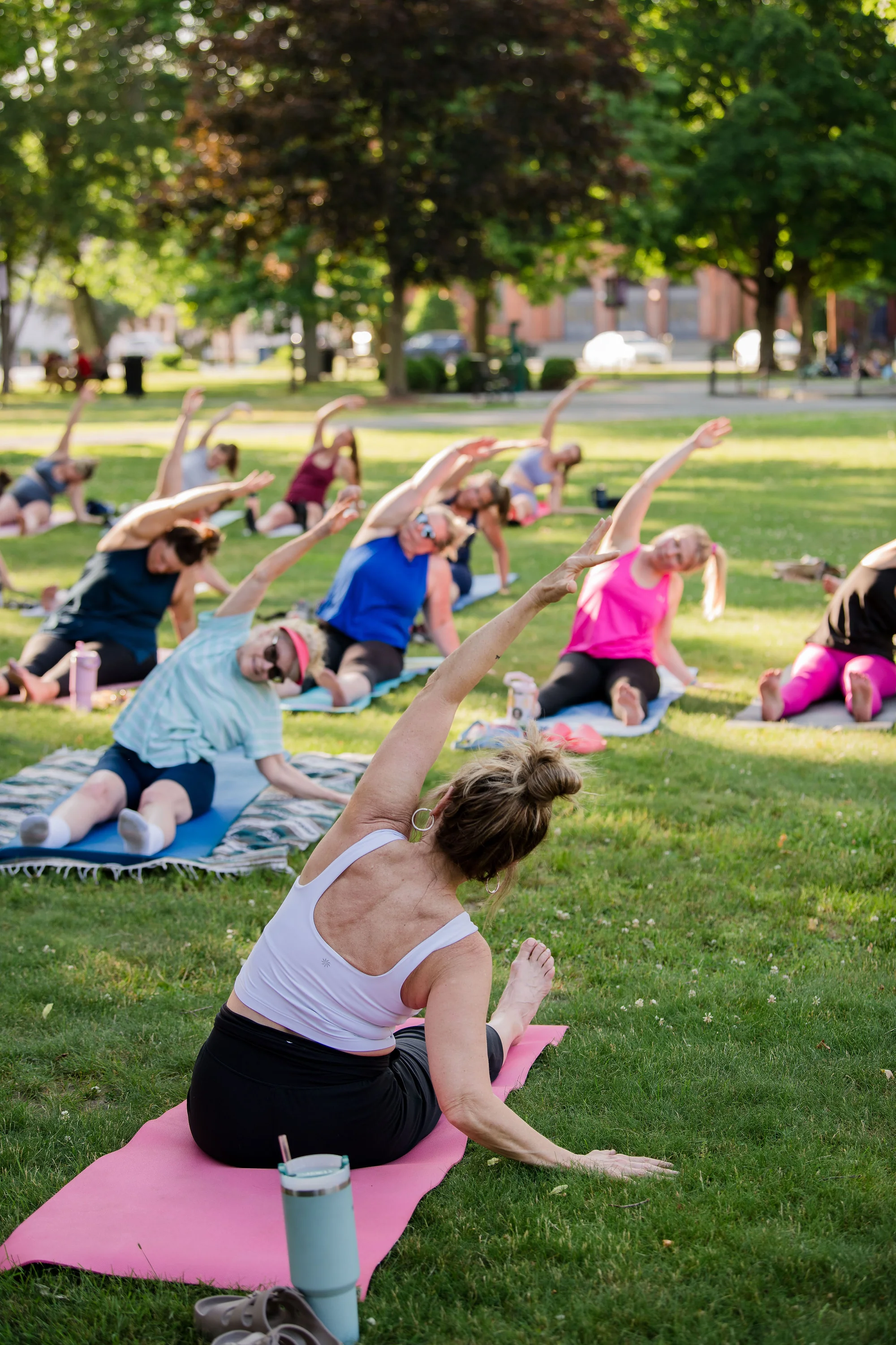 Get Flexy member stretching outdoors during a Yoga in the Park class